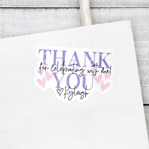 May include: Purple and pink thank you sticker with the text "Thank you for celebrating with me!" and the name "Kyleigh" in a heart.
