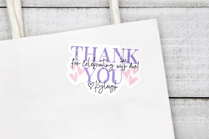 May include: Purple and pink thank you sticker with the text "Thank you for celebrating with me!" and the name "Kyleigh" in a heart.