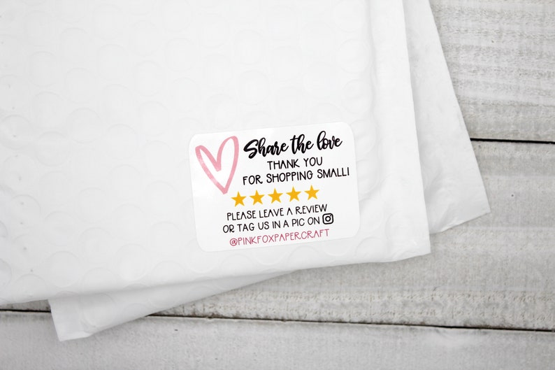 May include: A white sticker with a pink heart and gold stars. The sticker says "Share the love, Thank you for shopping small!" and "Please leave a review or tag us in a pic on @PINKFOXPAPERCRAFT".