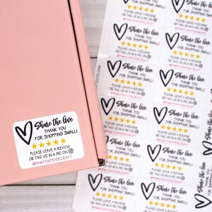May include: White sticker with a black heart and the text "Share the love, thank you for shopping small". Five gold stars are below the text. The sticker also includes the text "Please leave a review or tag us in a pic on @pinkfoxpapercraft".