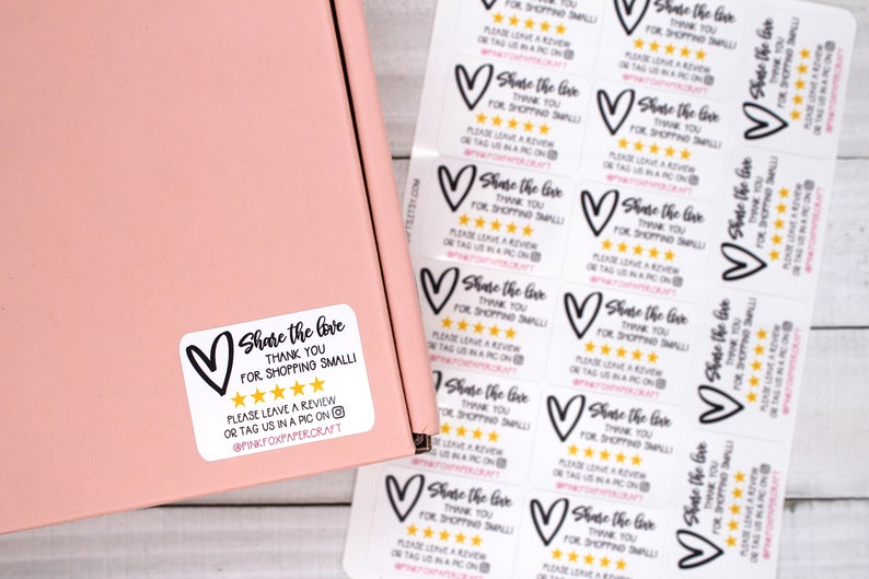 May include: White sticker with a black heart and the text "Share the love, thank you for shopping small". Five gold stars are below the text. The sticker also includes the text "Please leave a review or tag us in a pic on @pinkfoxpapercraft".