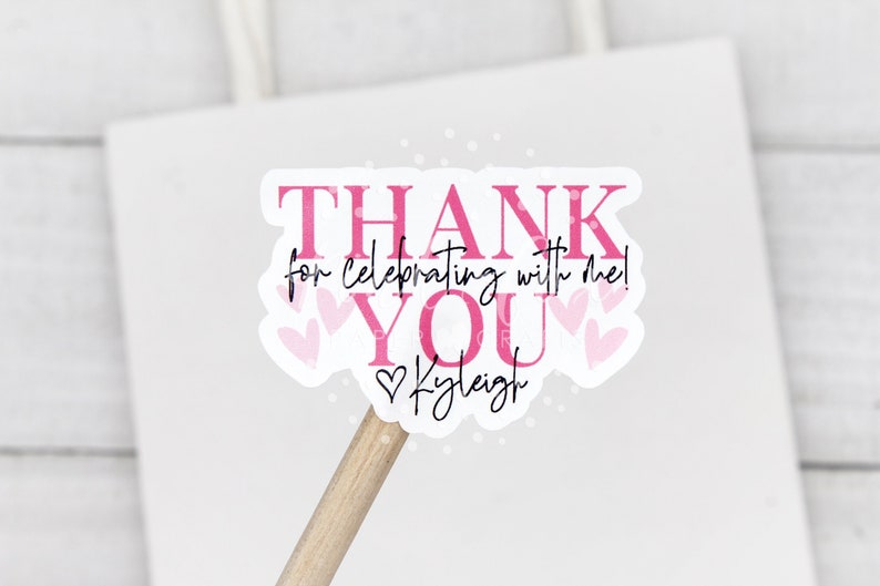 May include: Pink and white thank you sticker with the text "Thank you for celebrating with me!" and the name "Kyleigh" in a heart.