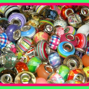 May include: A collection of colorful beads with various designs, including stripes, floral patterns, and solid colors. The beads are made of glass and metal, with a variety of shapes and sizes. The color palette includes red, blue, green, and yellow.