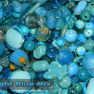May include: A mix of light blue glass and ceramic beads in various shapes and sizes. The beads are perfect for jewelry making, crafts, and home decor.