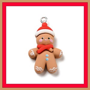 May include: A gingerbread man charm with a red Santa hat, scarf, and rosy cheeks. The charm has a silver loop for hanging. The gingerbread man has white icing details and blue buttons.