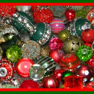 May include: A collection of assorted decorative beads in various shapes, sizes, and textures. The assortment features round, spherical, and textured beads in vibrant shades of red, green, gold, and silver, with some beads displaying intricate metallic filigree, sparkling rhinestones, or striped patterns.