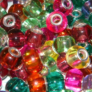 May include: A collection of colorful glass beads in various shades of red, green, pink, orange, and yellow. Each bead has a silver-colored metal core. The beads are round and transparent, creating a vibrant and eye-catching display.