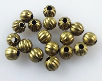 NEW 100/pcs METAL Tibetan Bright polished Bronze Pumpkin ridged round Spacer bead lot 5.5x6mm with a 1.0mm Hole (BBR1)