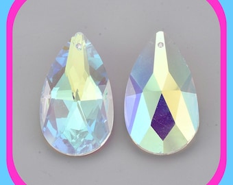 May include: Two iridescent teardrop-shaped crystal pendants with a faceted design. The crystals are clear with a rainbow sheen.