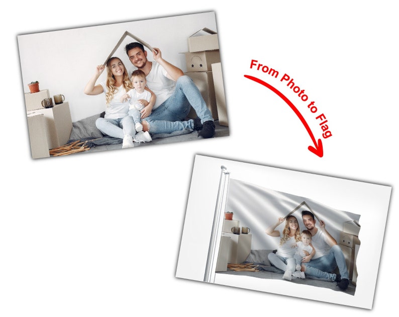 May include: A family of three, a man, a woman, and a child, are sitting on the floor in front of a pile of cardboard boxes. They are holding up a cardboard box over their heads to form a house shape. The image is printed on a white flag.