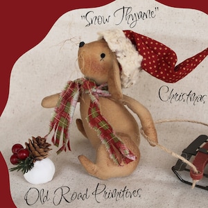 May include: A brown and white Christmas mouse doll wearing a red and white Santa hat and a green and red plaid scarf pulls a red sled filled with white snowballs. The text "Snow Thyme" and "Christmas Mouse" are written on the image.