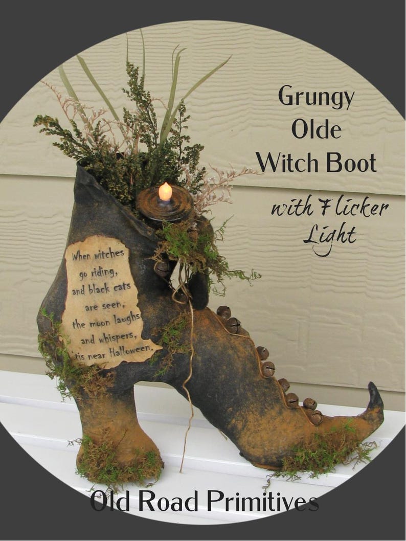 May include: A dark, distressed witch boot decoration featuring a flickering LED light, green foliage, and small metal bells. A parchment-style label reads: When witches go riding, and black cats are seen, the moon laughs and whispers, 'tis near Halloween.