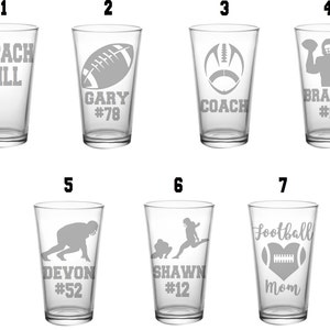 May include: Set of ten clear glass pint glasses with various football-themed designs, including names, numbers, and footballs.