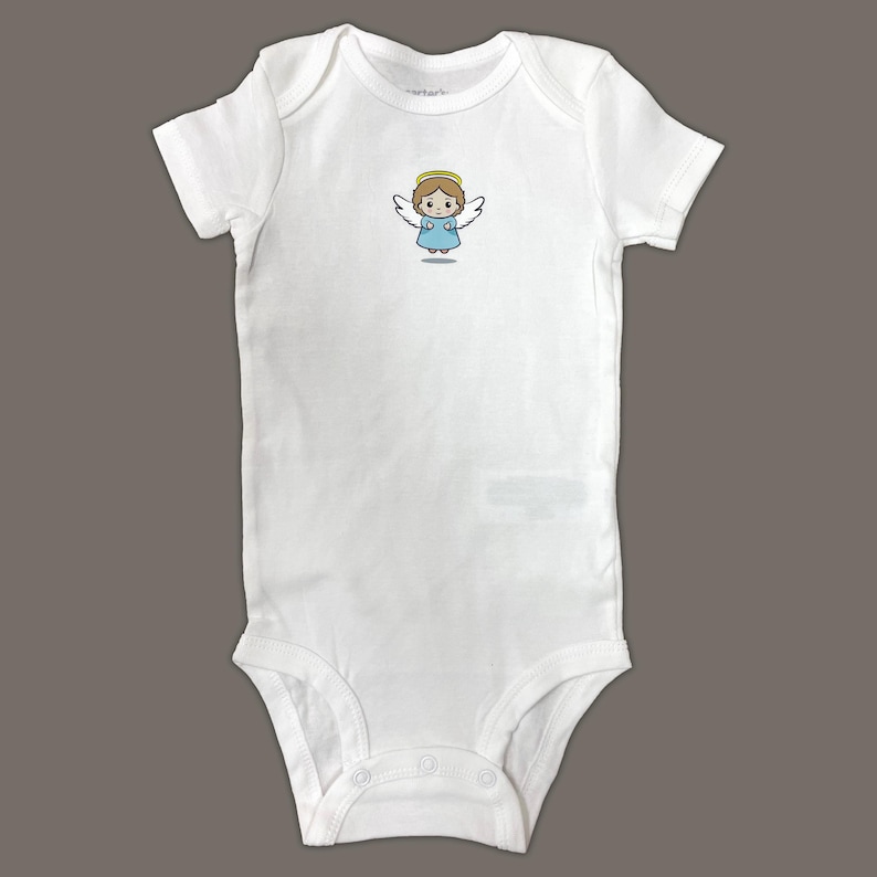 May include: White baby onesie with a cartoon angel design. The angel is wearing a blue dress and has a halo.
