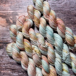 Summer Gardens | Variegated and speckled fingering weight yarn in pink and green for knitting, crochet, and weaving