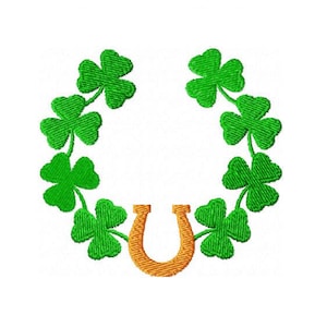 May include: An embroidered design featuring a green shamrock wreath and a gold horseshoe on a white background. The shamrocks are arranged in a circular pattern, with the horseshoe at the bottom, symbolizing luck and St. Patrick's Day.