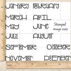 May include: A white square grid with the months of the year printed in black, stylized font. The text "Stamped image sizes" is also present. A wooden ruler with inch measurements is in the image.