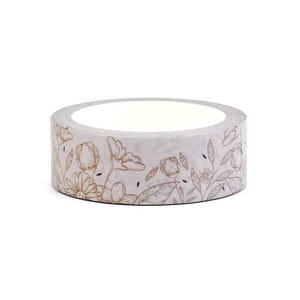 May include: A roll of decorative washi tape featuring a floral design in gold on a light gray background. The tape is round and appears to be made of paper, perfect for crafts, scrapbooking, and adding a touch of elegance to any project.