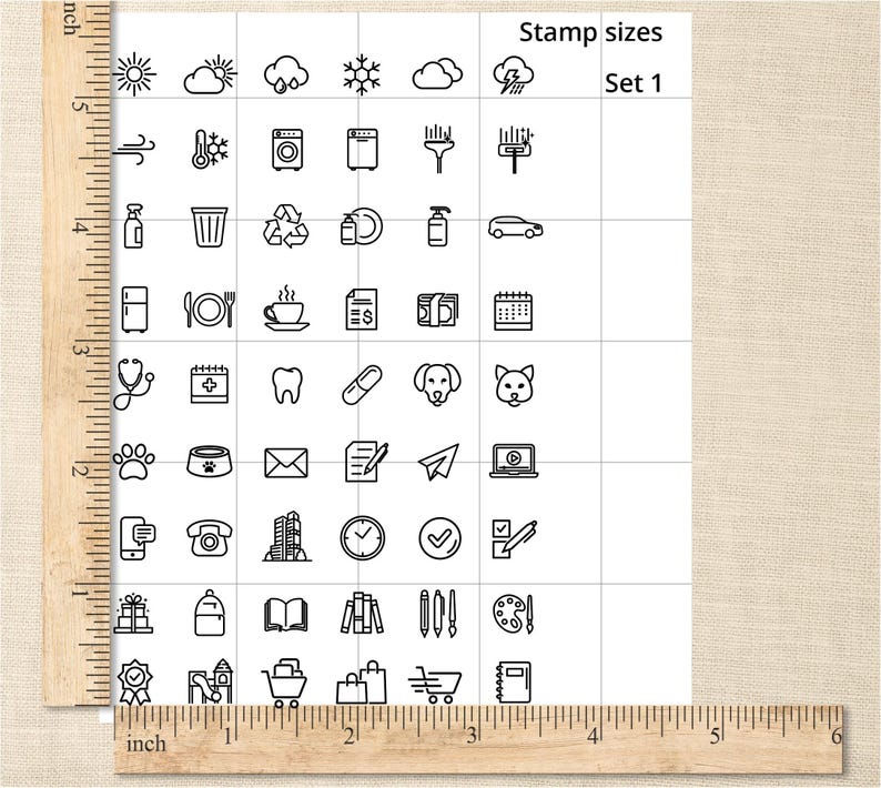 May include: A grid of black and white icon stamps, including weather symbols, household items, and various objects. The text "Stamp sizes Set 1" is at the top. A wooden ruler is on the left side, with inch measurements.