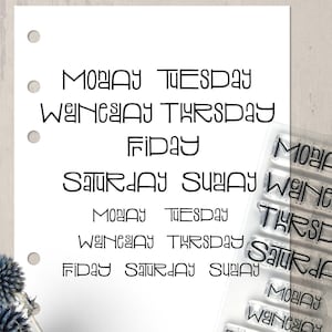 May include: A white sheet of paper with the days of the week printed in black. A clear stamp set with the days of the week is visible on the right side of the image.