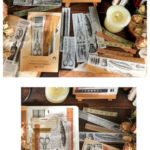 May include: A collection of vintage-style decorative stickers, rulers, and ephemera. The stickers feature scissors, ink bottles, and feathers. The color palette includes beige, brown, and black. The image also includes a lit candle and dried flowers.