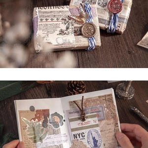 May include: Two small, wrapped packages with vintage paper and decorative elements. One is adorned with a butterfly and a gold coin, the other with a red wax seal. An open journal with vintage ephemera and the text "NYC" is also visible.