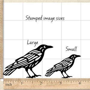 May include: Black raven silhouette designs labeled "Large" and "Small" on a grid, with a wooden ruler showing inch measurements. The text "Stamped image sizes" is written above the raven illustrations.