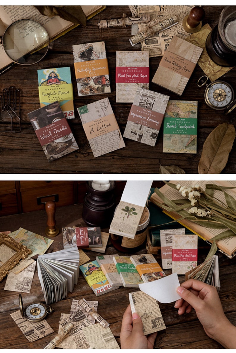 May include: A collection of vintage-style memo pads and notebooks with various designs and text. The pads feature printed covers with images and text, including "Butterfly Specimens" and "Ideal Guide". The color palette includes beige, brown, and touches of red and green.