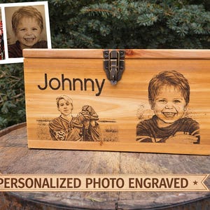 May include: A wooden chest with a metal clasp, engraved with the name "Johnny" and two photos. One photo is of a young boy, and the other is of a young man. The text "PERSONALIZED PHOTO ENGRAVED" is below the chest.