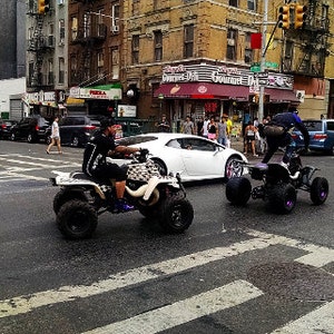 New York City photo: Street Circus in El Barrio - trick riding ATV&#39;s down Lexington Avenue in NYC - Spanish Harlem - East Harlem - Manhattan