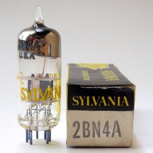 May include: A vintage Sylvania 2BN4A vacuum tube with a clear glass body, silver top, and yellow lettering. The tube is next to its original black and yellow box, also labeled "SYLVANIA" and "2BN4A".