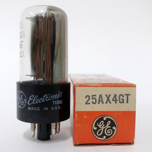 May include: A vintage General Electric 25AX4GT vacuum tube in its original box. The tube is clear glass with a black base and the box is orange with black text.