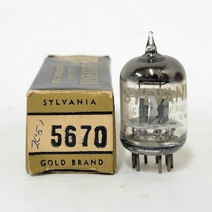 May include: A vintage Sylvania 5670 Gold Brand vacuum tube with its original box. The tube is clear with a dark top and multiple pins. The box is tan with black text, including "5670" and "Gold Brand".