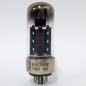 May include: A vintage RCA Radiotron electron tube. The glass tube has a rounded top and a silver base with the text "RCA ELECTRON TUBE". The internal components are visible through the clear glass.