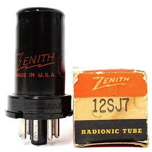 May include: A black Zenith 12SJ7 vacuum tube with metal pins at the base and red text reading Zenith Made in U.S.A. Next to it is a rectangular cardboard box featuring the Zenith logo, the text 12SJ7, and the words Radionic Tube in yellow.