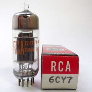 May include: A vintage RCA 6CY7 vacuum tube in its original box. The tube is clear glass with a silver top and the box is red with white lettering.