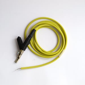 May include: A yellow electrical test lead with a black alligator clip.