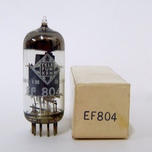 May include: A clear glass vacuum tube with a metallic internal structure and a Telefunken logo printed on the side, labeled EF 804. Next to it is a rectangular beige cardboard box with the text EF804 printed in black on the front face.