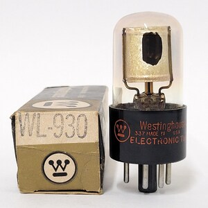 May include: A vintage Westinghouse WL-930 vacuum tube in its original box. The tube is clear glass with a black base and five pins. The box is brown with a white Westinghouse logo and the text "WL-930" in black.