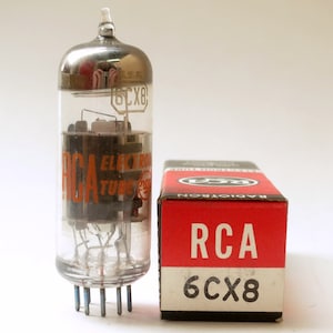 May include: A vintage RCA 6CX8 vacuum tube in its original box. The tube is clear glass with a silver top and the box is red with white lettering.