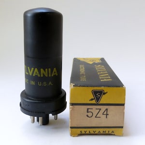 May include: A black Sylvania 5Z4 electronic tube with a cylindrical shape, next to its original box. The tube has the Sylvania logo and "Made in U.S.A." printed in yellow. The box is yellow and black with the Sylvania logo and "5Z4" printed on it.