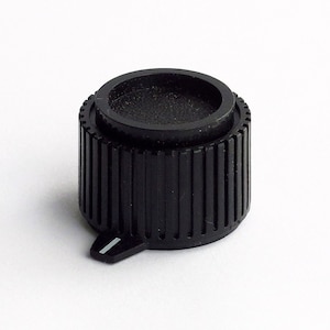 May include: Black plastic knob with a ribbed edge and a small white indicator line.