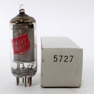 May include: A clear glass vacuum tube with a red and white label that says "Heat Timer". The tube is in a white box with the number "5727" printed on it.