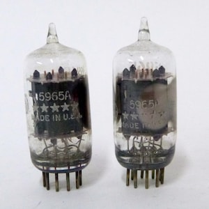 May include: A set of three ceramic mugs with a speckled, matte finish. The mugs are in shades of cream, light gray, and dark gray. Each mug has a simple, minimalist design, perfect for coffee or tea.