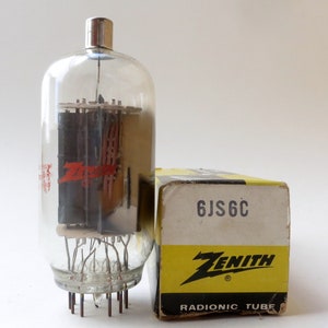 May include: A vintage Zenith 6JS6C vacuum tube in a clear glass envelope with a black and red Zenith logo. The tube is in its original box, which is yellow with black text and a Zenith logo.