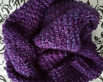 May include: A purple and blue knitted scarf with a soft, fuzzy texture.