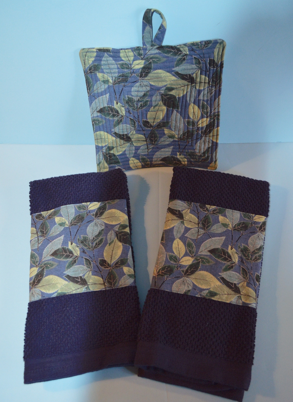Blue kitchen towels and potholders