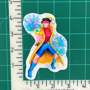 May include: A watercolor illustration of a superhero character with blue and yellow clothing, a pink shirt, and blue hair. The character is surrounded by colorful splashes of paint.