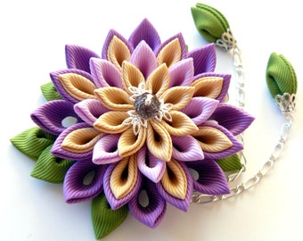 Kanzashi fabric flower hair clip. Shades of purple, toffee and apple green.