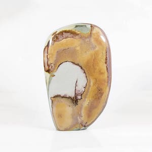 May include: A polished, oval-shaped stone with a unique pattern. The stone features a blend of colors, including shades of brown, tan, and white, with hints of purple and green. The overall shape is smooth and rounded, with a natural, organic aesthetic.